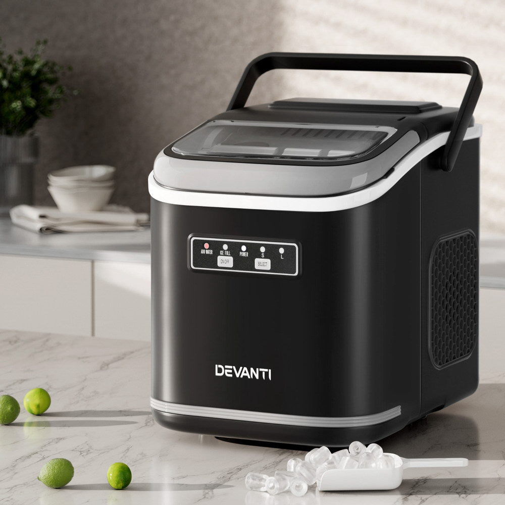 Black Devanti ice maker on a kitchen counter with ice cubes and limes around