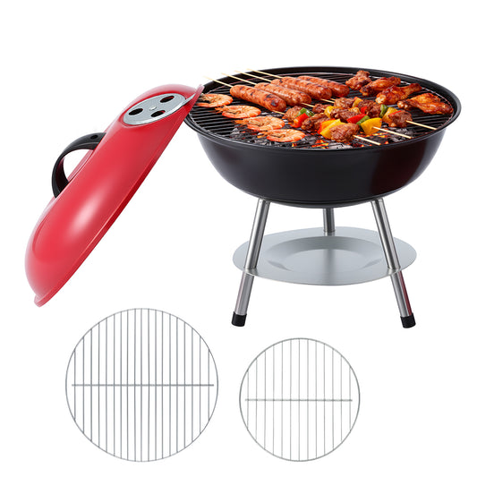 Black portable grill with red handle and food on a white background