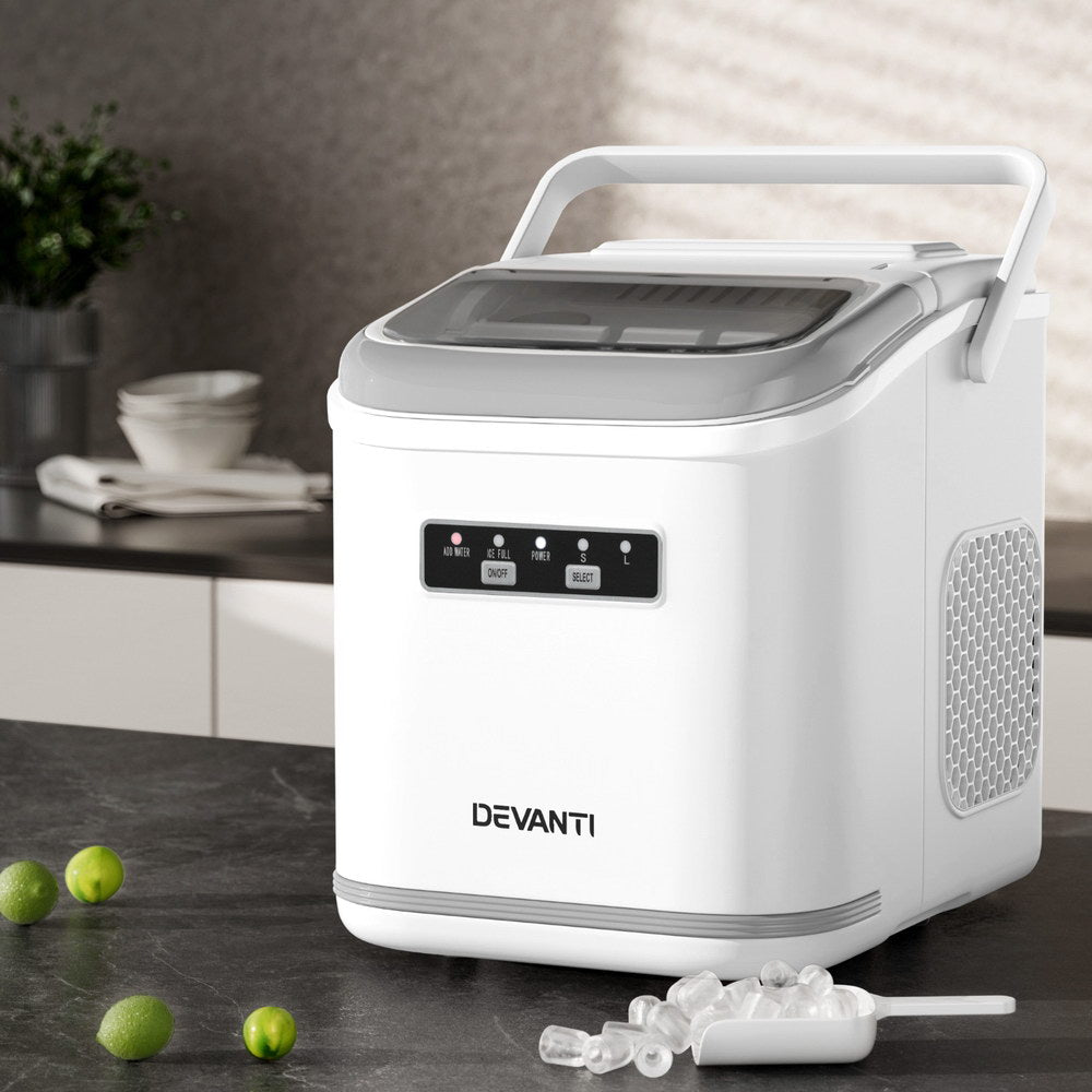 White Devanti ice maker on a kitchen counter with ice cubes and limes.