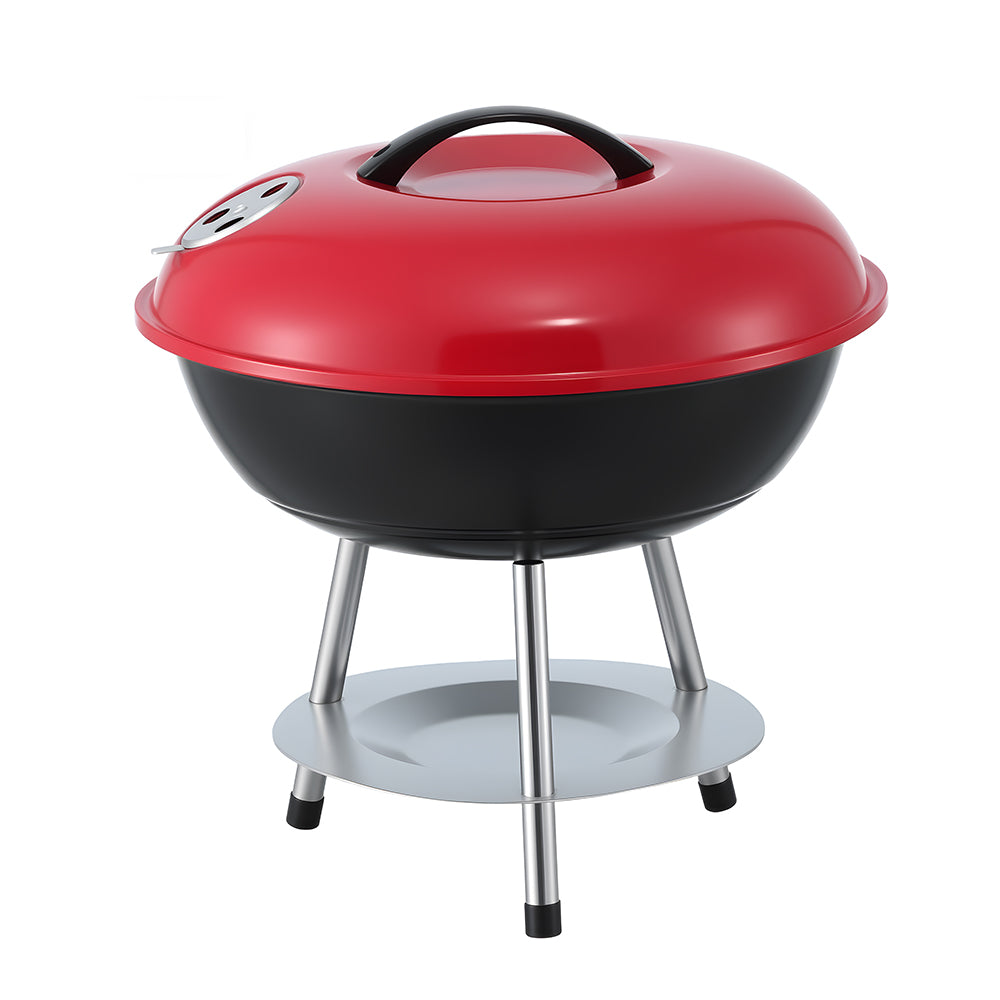 Red and black barbecue grill on a white background