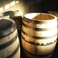 Wooden barrels in a dimly lit setting